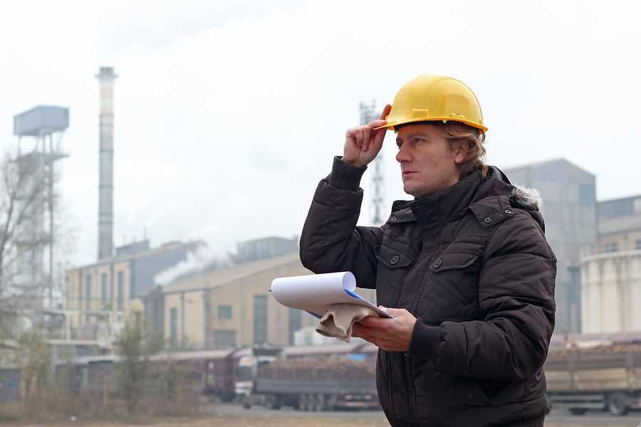 Man Looking at OSHA Safety Checklist
