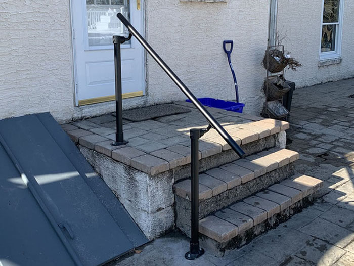 black handrail outside the house