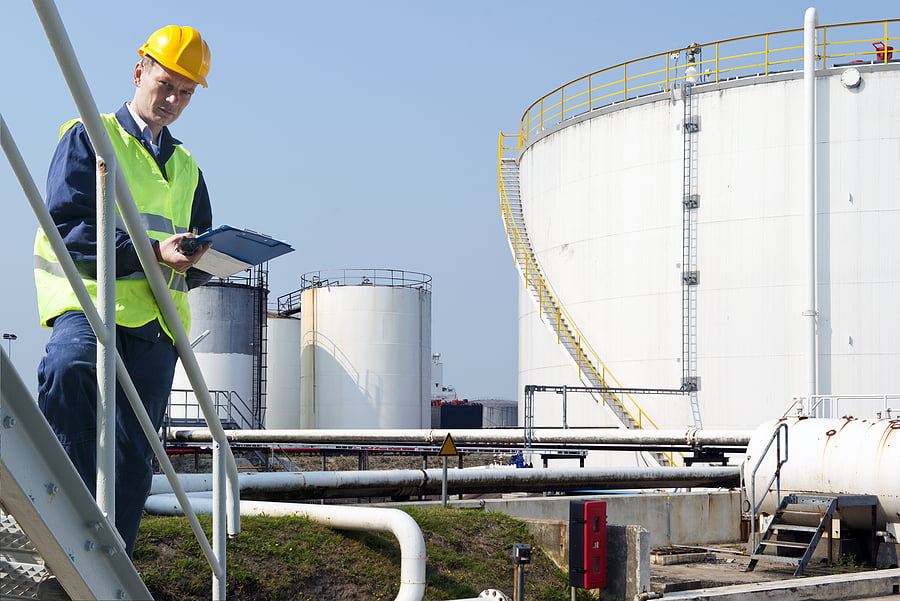 worker assessing rooftop